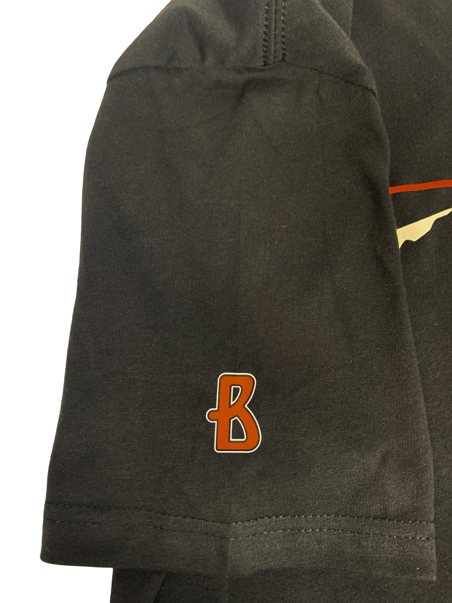 A close-up of a sleeve on a black Short-sleeve T-shirt with a crewneck and a relaxed fit. The illustration is the letter "B" in the color of orange. Made from soft cotton or for comfort and durability.