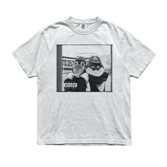 A light gray heather crewneck t-shirt featuring a black and white graphic print of two penguin mascots posing together with a 'Parental Advisory' label overlay, displayed flat against a white background.