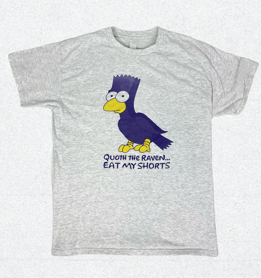 A T-shirt that is Ash White Color feature a centered image of Bart the Raven with text under this image that states "Quoth the Raven...Eat My Shorts"